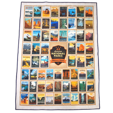 Beautiful handmade quilts  are the perfect addition to the home or as a gift to a national parks enthusiast. This large panel features the 63 American National Parks Wilderness & Wonder patch surrounded by a patchwork of 63 unique national park posters.  Sewn with coordinating binding and quilted in a topography pattern for a stunning finish. Finished size: 54