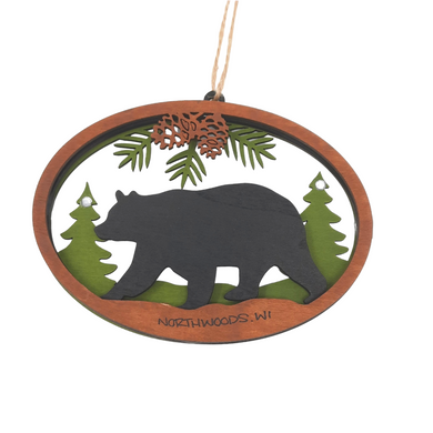 Reminisce about your Northwoods life with this beautiful holiday ornament. Perfect souvenir from your Northwoods, Wisconsin adventures in iconic Apostle Islands, Bayfield, Washburn, and Ashland areas. Woodcut scene of a black bear, trees & pinecones. Size: 5
