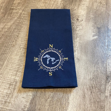 Load image into Gallery viewer, This beautiful navy blue tea towel features a Great Lakes design embroidered within a compass face.