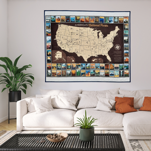 Commemorate your love of the National Parks with this handmade quilted wall hanging. The intricate design is crafted to last, becoming a timeless addition to any home decor or as a treasured gift.   Easily commemorate your travels with additional hand-stitching or pins.  This panel features a map of the national parks in the United States of America bordered by national park posters. Made in Wisconsin, USA by AdventureUs