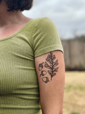This oak leaf and three acorns temporary tattoo measures 2.5 x 3.5 inches and is hand-drawn, with black and grey lines and stippling. Wear the oak leaf and acorns together or cut them out and share with friends!
