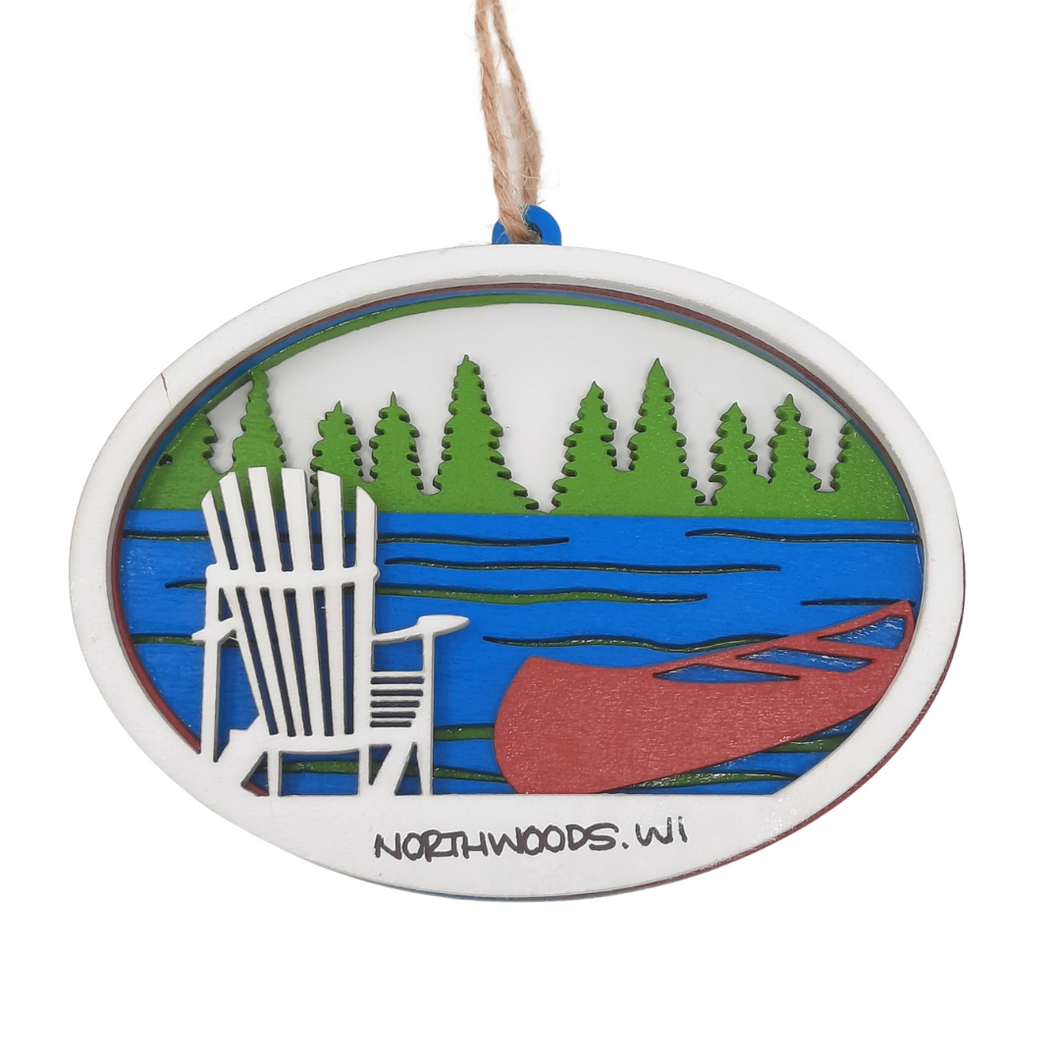 Reminisce about your Northwoods life with this beautiful holiday ornament. Perfect souvenir from your Lake Superior adventures in iconic Apostle Islands, Bayfield, Washburn, and Ashland areas in Wisconsin. Woodcut scene of a wooded lakeshore with Adirondack chair and canoe. Size: 5