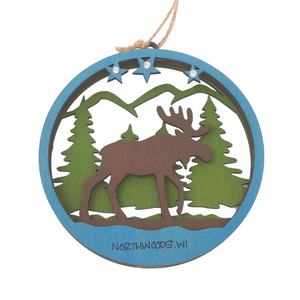 Reminisce about your Northwoods life with this beautiful holiday ornament. Perfect souvenir from your Lake Superior adventures in iconic Apostle Islands, Bayfield, Washburn, and Ashland areas in Wisconsin. Woodcut scene of a moose in the woods. Size: 5" x 3.5"