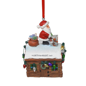 Reminisce about your Northwoods life with this beautiful holiday ornament. Perfect souvenir from your Northwoods, Wisconsin adventures in iconic Apostle Islands, Bayfield, Washburn, and Ashland areas. Santa's about to drop down the chimney of this festive cabin. Size: 2.5" x 3.5"