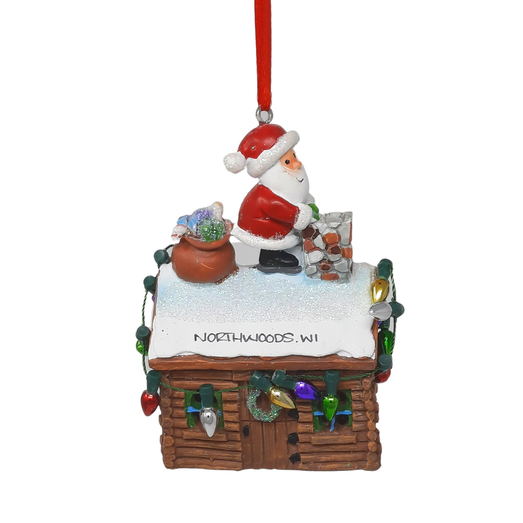 Reminisce about your Northwoods life with this beautiful holiday ornament. Perfect souvenir from your Northwoods, Wisconsin adventures in iconic Apostle Islands, Bayfield, Washburn, and Ashland areas. Santa's about to drop down the chimney of this festive cabin. Size: 2.5