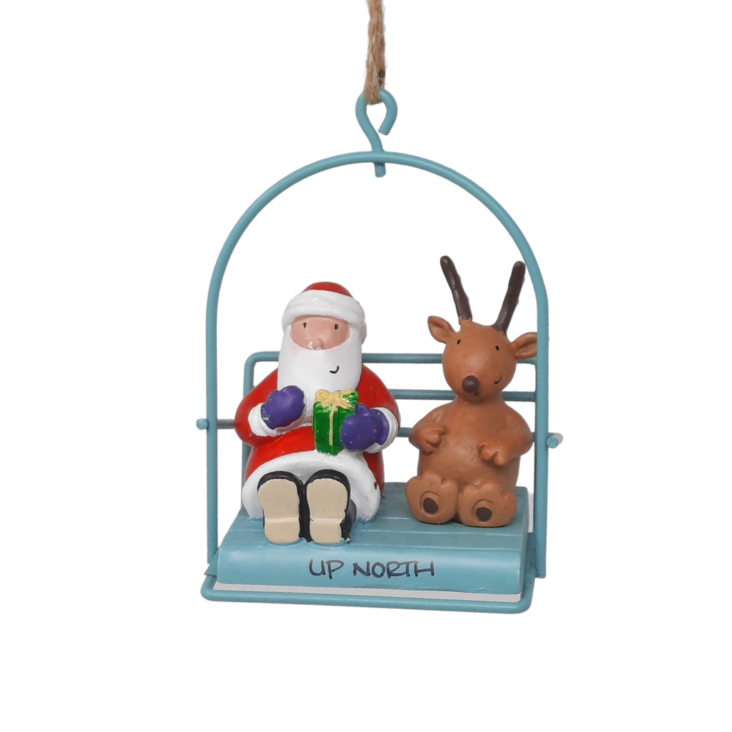 Reminisce about your Northwoods life with this beautiful holiday ornament. Perfect souvenir from your Up North adventures in iconic Apostle Islands, Bayfield, Washburn, and Ashland areas. Santa and a reindeer in a chairlift Size: 2.5