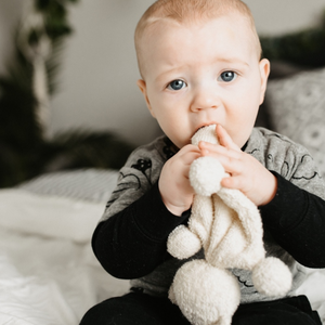 This soft and cuddly organic cotton teething bear makes the perfect new baby gift.