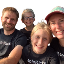 Load image into Gallery viewer, The faces behind the Wee-Kicks! Every pair is handcrafted by this loving family who live on the coast of Lake Superior in the North-woods of Wisconsin. They strive to make the world a more kickin&#39; place, one sole at a time. 