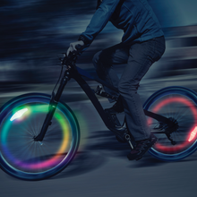 Load image into Gallery viewer, Hours of fun for dark winters or summer nights with this rechargeable bike wheel LED light.