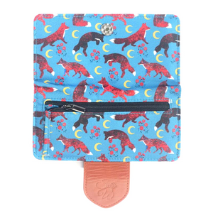 This wallet has everything you need plus a beautiful print! Measures 6.75 inches long x 3.5 inches wide x .5" deep Zip change compartment,14 card slots & clear ID slot Made with 100% recycled water-resistant polyester and vegan leather Magnetic closure