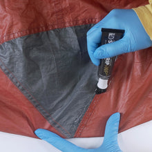 Load image into Gallery viewer, Seam Grip WP is a tent seam sealer that goes above and beyond to keep moisture out. Seal up to 12 ft of tents, tarps, and awnings with a single 1 oz tube. As a permanent waterproof sealant, it keeps outdoor enthusiasts dry and comfortable. It’s also a flexible repair adhesive that can patch up holes in all types of fabric including vinyl, nylon and canvas. So, take this clear glue along on the next camping trip, and be ready when gear rips, leaks or falls apart.