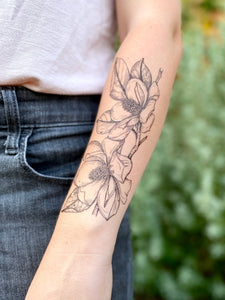 Express yourself with this fun nature-themed temporary tattoo.  This hand-drawn floral design measures 6.25 by 2.5 inches with black lines and stippling.   Made in Austin, TX USA