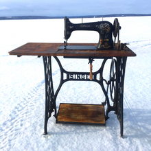 Load image into Gallery viewer, This is the treadle sewing machine that is used to create each pair of Wee-Kicks.  The owner and creator, Zach, enjoys creating shoes and spending time outdoors. When possible he does both at the same time! 
